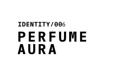 A minimalist typographic graphic displaying the text 'IDENTITY/006' stacked above the words 'PERFUME AURA' in bold, black lettering on a white background