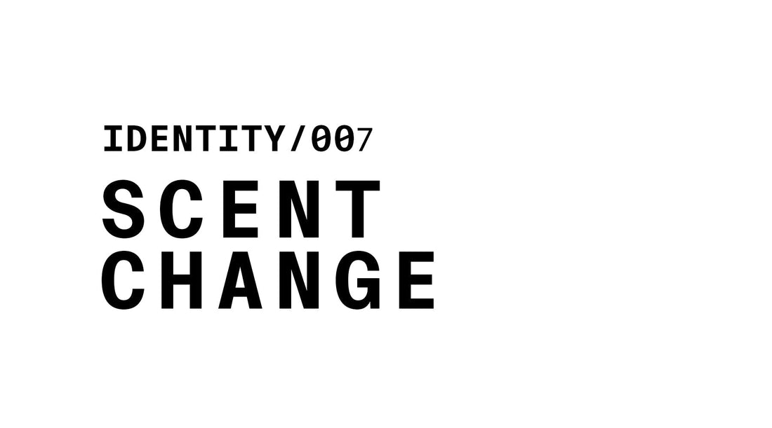 A minimalist graphic with a white background and black text reading: IDENTITY/007, followed by the words SCENT CHANGE in bold, stacked below it.