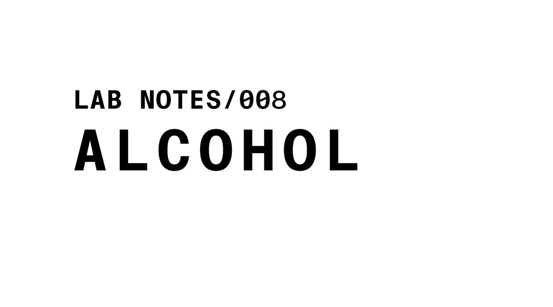 The image is a black and white graphic with the words "LAB NOTES/008" at the top left in a smaller, sans-serif font. Below it, in a much larger, bold sans-serif font, is the word "ALCOHOL". The background is plain white.